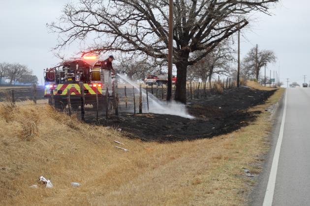 Granite Shoals Fire Rescue crews doused several areas on the perimeter of a fire Feb. 23 which scorched approximately 40 acres on rural property just east of Granite Shoals on RR 1431. Photos by Connie Swinney/The Highlander