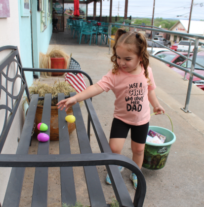 (At left) Little Izabella Yarbrough of Horseshoe Bay was among hundreds of children who participated in the Downtown Egg Scavenger Hunt on Good Friday in Marble Falls. See more photos on Page 5. Photos by Connie Swinney/The Highlander