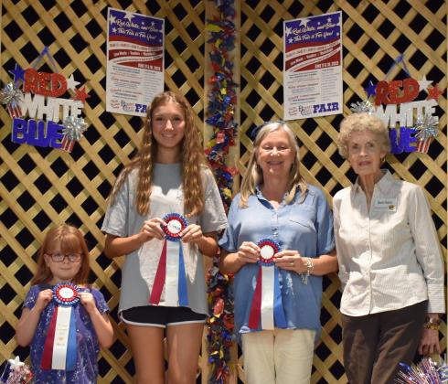 Buttons: Pictured, from left, are Genevieve McDonald, Avery Meredith, Amanda Hensley, Jan Graves (Superintendent).
