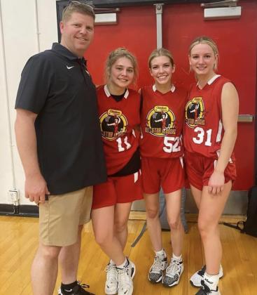 Marble Falls High Coach John Berkman is pictured with Lady Mustang senior basketball players Tea Rodriguez, Alyssa Berkman and Emma Koziel. The players took part in the Chicken Express Basketball All-Star Classic in Fredericksburg. Contributed photo