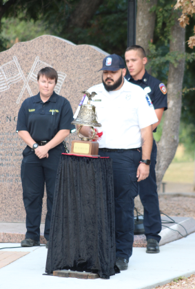 Pictured, from left, are Marble Falls Police Dept. Crime Scene Technician Rachel Baldree, Marble Falls Area EMS EMT Roy Flores and Marble Falls Fire Rescue Firefighter Ross Moore, during the Rotary Club of Marble Falls 9/11 ceremony Sept. 11 at the Veterans and First Responders Memorial Park in Marble Falls. See more photos on Page 3.