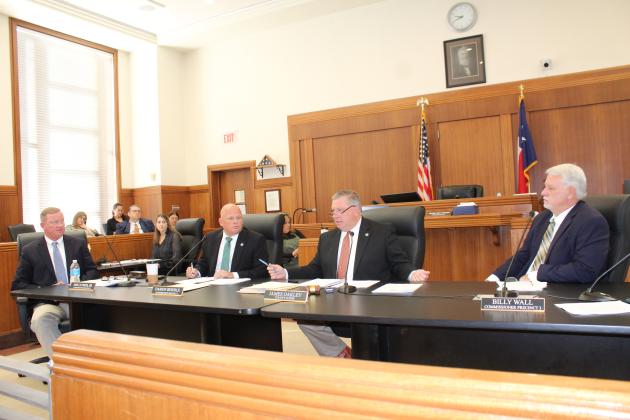 From left, Pct. 1 Commissioner Jim Luther Jr., Pct. 2 Commissioner Damon Beierle, County Judge James Oakley and Pct. 3 Commissioner Billy Wall debate public conduct issues during the Nov. 14 meeting. Raymond V. Whelan/The Highlander