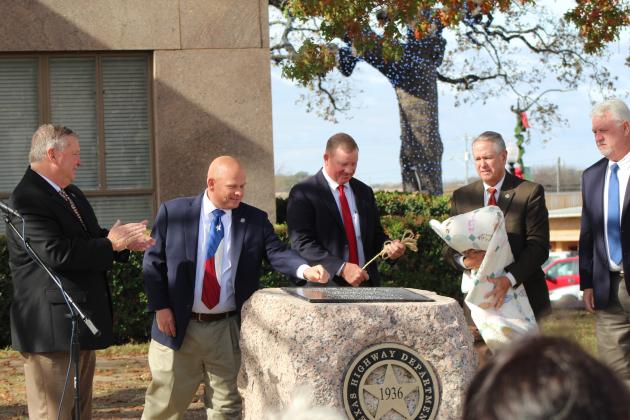 (From left) Burnet County Pct. 1 Commissioner Jim Luther Jr., Pct. 2 Commissioner Damon Beierle, Judge James Oakley, Pct. 3 Commissioner Billy Wall and Pct. 4 Commissioner Joe Don Dockery rededicate and unveil the 1936 Granite Mountain Marker along the County Courthouse east side during a brief ceremony sponsored by the Burnet County Historical Commission Dec. 12. 