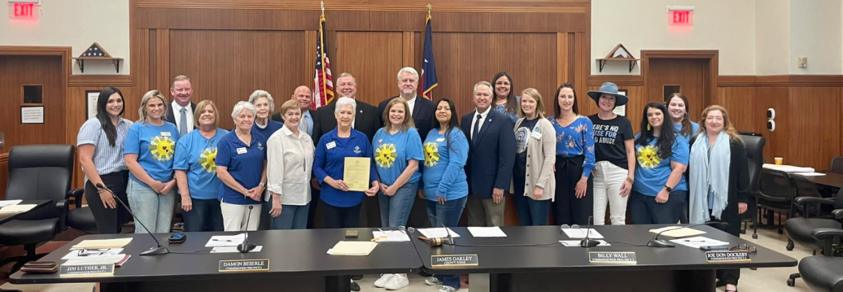 Members of the Burnet County Child Welfare Board, Court-appointed Special Advocates (CASA) for the Highland Lakes and Hill Country Children's Advocacy Center are pictured here April 9 with Burnet County commissioners and county officials (back row) after the government body proclaimed April  Child Abuse Awareness Month.