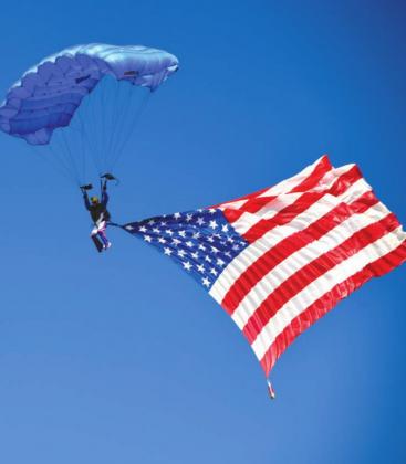 A parachuter inspired patriotism and awed the crowd at the Bluebonnet Air Show on March 19 in Burnet. Photos by David Matney/Contributing photographer