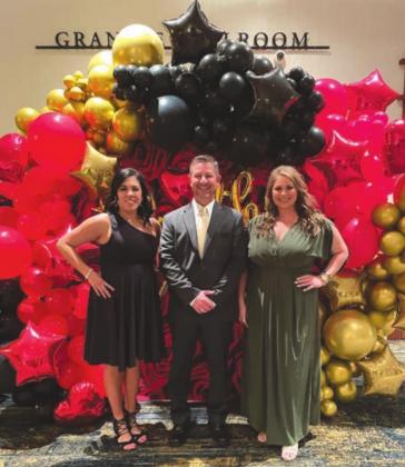 Marble Falls/Lake LBJ Chamber of Commerce admistration Veronica de la Hoya (left), membership coordinator; Jarrod Metzgar CEO/president; and Katie Savage, special events coordinator organized the event which has received accolades from attendees for its element of glamour, fine dining and well-deserved honors for leaders in the business community.