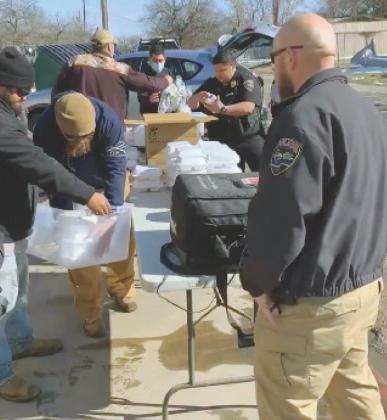 Granite Shoals Police Department and city officials distributed food during the winter storm event last week. City Manager Jeff Looney said he was proud of the city and community response. Contributed/GSPD