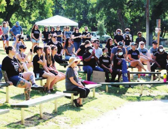 Left: A crowd of about 200 people including here at the pavilion seating area and the Backbone Creek side of Johnson Park attended the June 13 Black Lives Matter protest event in Marble Falls.