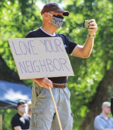 A man, who identified himself as a military veteran, was in the audience to document the protest event, organized by local Black Lives Matter supporters, in Johnson Park in Marble Falls. Photos by Connie Swinney/The Highlander