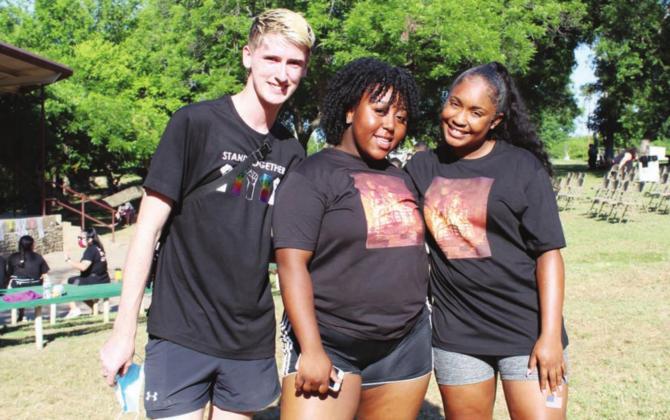 Local Black Lives Matter and 2020 Marble Falls High School graduates, from left, Bryce Laake, Shyann Brown and Mauri Harris co-organized the local event which featured speakers in Johnson Park and a protest March along Main Street.