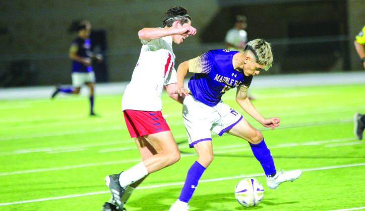 Victor Sanchez battles for control of ball. Photos by Natalie Dietrich/Dietrich Photography