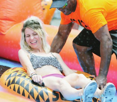 Horseshoe Bay resident Stephanie DeVault was among local residents in 2019 who attended the downtown water slide event down Third Street in Marble Falls. The amenity, sponsored by the Marble Falls/Lake LBJ Chamber of Commerce and Ms. Lollipop’s Parties Fun & Gifts, is Saturday and Sunday, June 19-20. Kelly McDuffie/Special to The Highlander