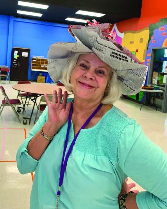 Jane Sinks, who volunteers with the Wesley Respite Center at First United Methodist Church, works with participants in the program which includes arts and crafts projects. Contributed photos