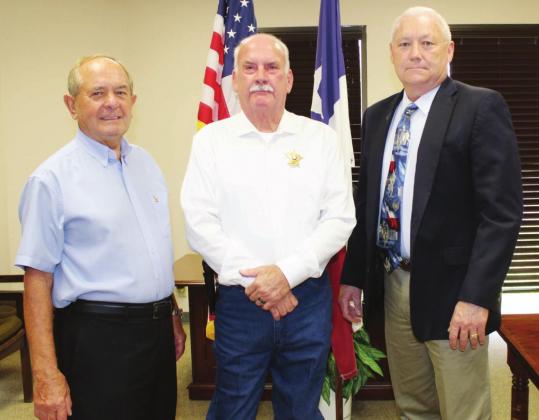 Pct. 1 Commissioner Peter Jones, on the left, attended the swearing in ceremony Sept. 1 of Constable Gary Silver with Judge Ron Cunningham presiding at the county annex in Horseshoe Bay.