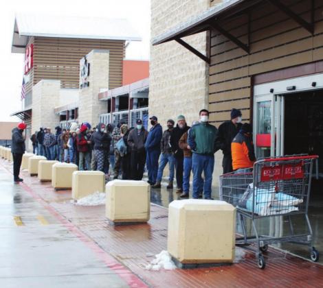 During peak times the week of Feb. 15, shoppers waited in line at HEBs in Marble Falls (pictured here), Burnet and Kingsland, due to workers limiting the number of people inside due to COVID-19 prevention measures. Connie Swinney/The Highlander