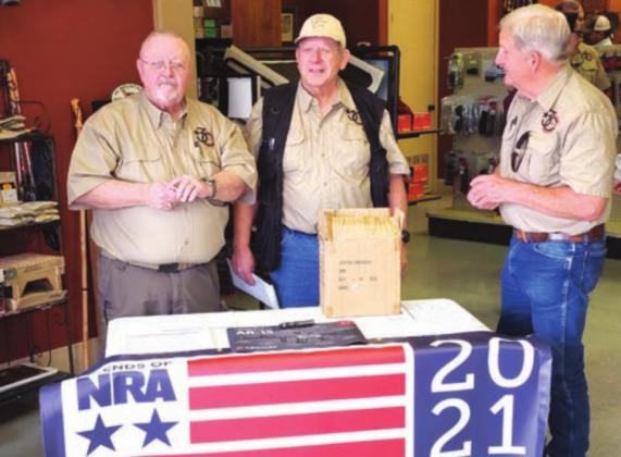On Texas Independence Day March 2, Burnet County Friends of NRA hosted their annual gun raffle at Outfitters – Rods, Barrels and Strings in Marble Falls. Pictured, from left, are Calvin Tidwell, Bob Cole and Jim Brewer who were managing the Wall of Guns drawing using a deck of cards to determine winners.