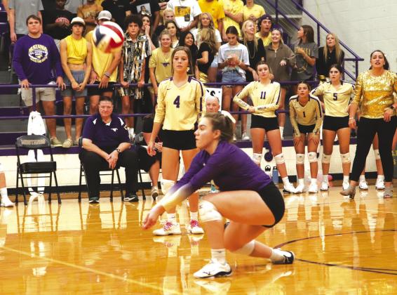 Sandra Gonzales digs a ball for Marble Falls. Burnet won the district match in straight sets.