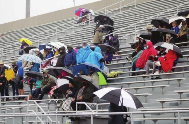 Mustangs fans didn’t let a little rain keep them from cheering on their squad on Saturday at Burger Stadium in Austin. The rainy weather called for warm jackets and umbrellas, and the Mustang faithful weathered the elements.