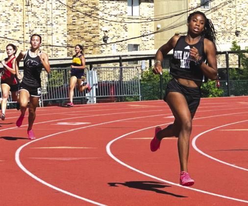 Faith Academy runner Faith Murphy closes strong in the 400 meters. She win the 400, 800 and 1600 to advance to the state meet May 5-6 at Waco Midway High School. The top-rated team in Region III-4A is China Spring from District 23-4A. Contributed photo