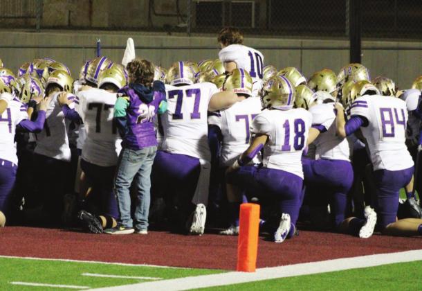 Senior quarterback Jake Becker (10) led the Mustangs in the pregame prayer for the last time on Friday night in Dripping Springs. Head Coach Brian Herman praised the Mustangs’ effort in the playoff loss.