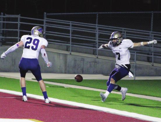 Right: Seniors Robert Adame and Ryan Minor (29) celebrated a touchdown for the last time in the 2021 season.