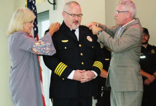 The Ballards were on hand for the ceremonious affixing of rank pins on his epaulettes following Glenn Hanson’s swearing in as the new MFPD police chief. Connie Swinney/The Highlander