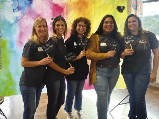 Children's therapists from the Phoenix Center, from left, are Carli Bartling, Ellie Anderson, Ann Gilbert, Jacqueline Galarza and Tiffany Goodsell, who contributed to the activities Oct. 10 for World Mental Health Day at Lakeside Pavilion in Marble Falls.