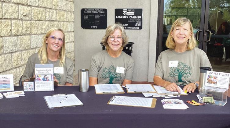 Phoenix Center volunteers (left to right) Amy Dutcher, Nancy Rissky, and Barb Gandy worked the check in booth for attendees of the World Mental Health Day Oct. 10 at Lakeside Pavilion in Marble Falls.