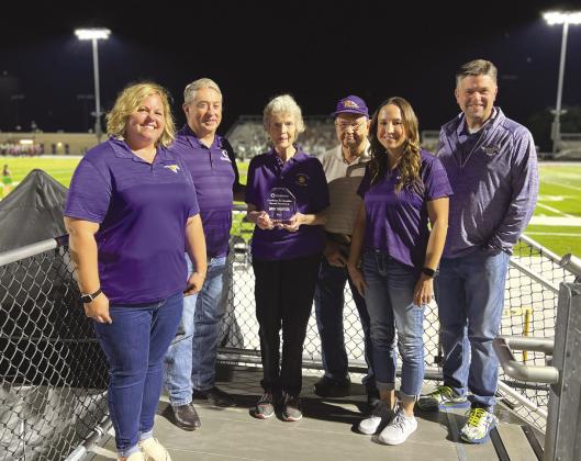 The Marble Falls Education Foundation (MFEF) presented Jan Graves, center, with the Excellence in Education Award Oct. 6 at Mustang Stadium. Pictured, from left, are Jeanna Jette, MFEF executive director; Scott Streit, MFEF board president; Graves and her husband Don; Superintendent Jeff Gasaway; and Amy Vinson, MFEF board member. Contributed photos/Ralph Arvesen