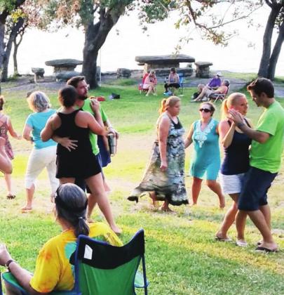Below left: Attendees enjoyed a dance on the lawn at a past Boogie by the Bay. File photo