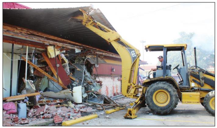 Crews started the demolition process of the Pizza Hut building Dec. 1 in Marble Falls to rebuild a new structure for the facility with a smaller restaurant eating area foot-print and the possibility of an ice cream parlor next door.