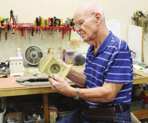 Above:Frank Crow has worked for several years repairing donated items including clocks and other household goods for sale to thrift store customers. “It’s a great place to work because of the people,” he said. Photos by Connie Swinney/The Highlander