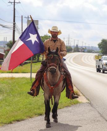 Pictured is veteran Jeremy Robinson riding Trooper along Hwy 29 June 2, heading towards Kingsland. His route has covered over a thousand miles bringing attention to veteran homelessness. He will conclude travels June 10 in Austin close to the capitol. Martelle Luedecke/ Luedecke Photography