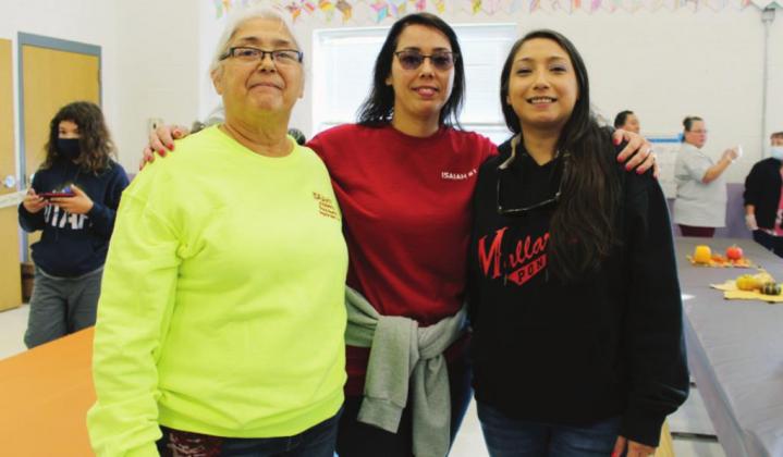 Left: Event co-organizer Guadalupe Guerrero (left) and daughters DeAndra Garcia and Seleste Kos were among volunteers Nov. 20 at the Joseph’s Food Pantry Thanksgiving lunch and food distribution program.
