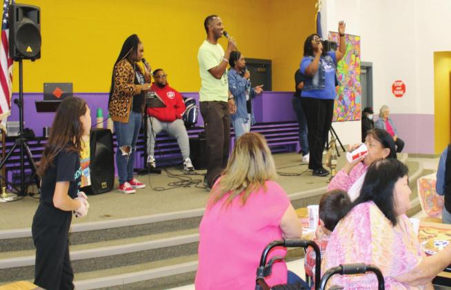Performers from Smoking for Jesus Ministry took the stage during the Joseph’s Food Pantry Thanksgiving event Nov. 20 at Highland Lake Elementary School.