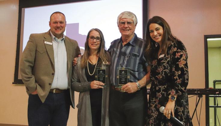 HLCN Executive Director Kevin Naumann, pictured with top volunteer awardees Dainne Lange and Glynn Wilson, and Rachel Naumann at the third annual fundraiser benefiting children in crisis at Lakeside Pavilion in Marble Falls Jan. 18.