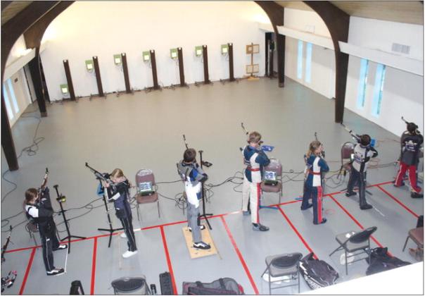 Photos by Raymond V. Whelan/The Highlander From left, Maggie Moore, Harper Sitra, Weiss Stanley, Asher Enterline, Eli Enterline, Klein Stanley and Elainna Marr recently practiced firing an air rifle at the new Burnet County 4-H Youth Rifle Team facility at 2802 S. Water St.