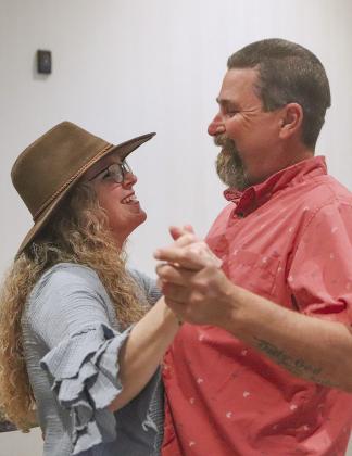 Left, Jodi and Mike Wagner of Burnet, practiced their boot scooting before the BBQ was served Saturday evening at CASA for the Highland Lakes Boots and BBQ fundraiser event Feb. 3 at Horseshoe Bay Resort.