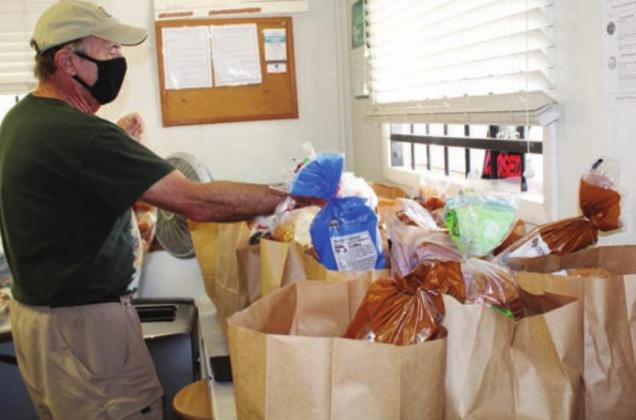 Terry Doran volunteered Sept. 14 to prepare items for clients of the Marble Falls Helping Center, 1315 Broadway Ave.