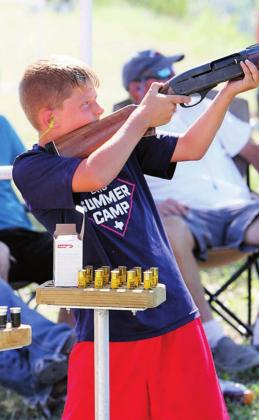 Braxton Dickens blasts the dickens out of a clay target during the youth competition at the Shoot for Coop annual clay shooting tournament and scholarship fundraiser on Saturday, June 13.