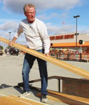 Jack Joyce of Marble Falls loads construction material into a trailer Dec. 23 at Home Depot. Purchase like his helped contribute to improving sales tax figures for the city. Connie Swinney/The Highlander