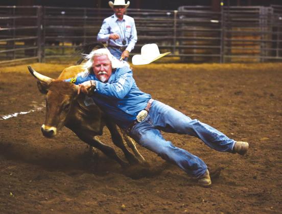 Dan Fancis-Head was one of the chute dogging participants at the May Military Cowboys Rodeo Association event at the John L. Kuykendall Arena in Llano. Coming up the first weekend in June, the dust will fly again at the arena during the Llano Open Pro Rodeo. Natalie Dietrich/Dietrich Photography