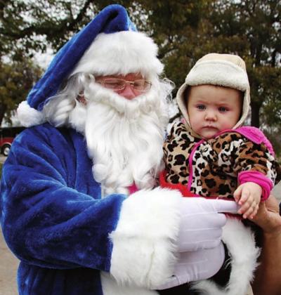 Blue Santa of Christmas’ past have made public appearances such as Main Street Market Day to promote the donation program. File photo