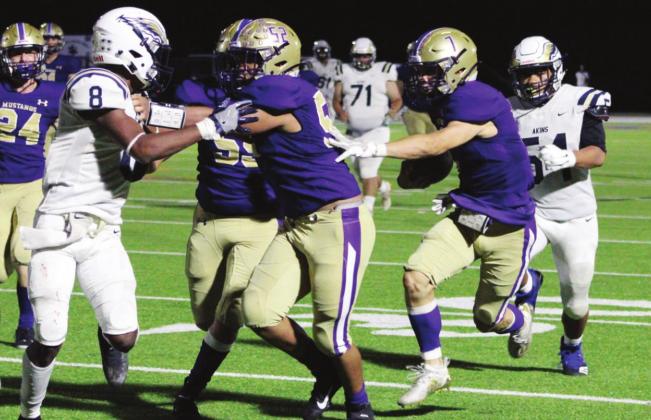 Senior back Robert Adame masterfully utilized his lead blockers on a long run against Akins. Head Coach Brian Herman credited the Mustangs’ success to the offensive line. Nathan Hendrix/The Highlander
