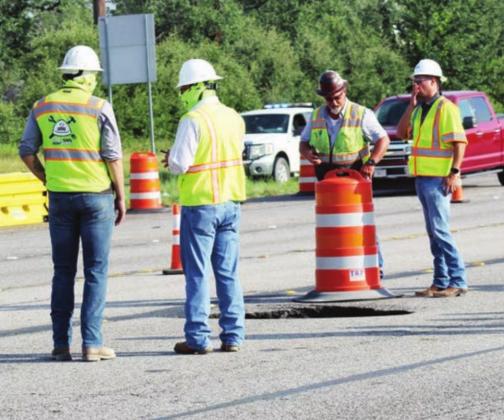 Crews worked Thursday, Aug. 19 to fix a large pothole in US 281 that TxDOT called an uncommon, isolated event. Connie Swinney/The Highlander