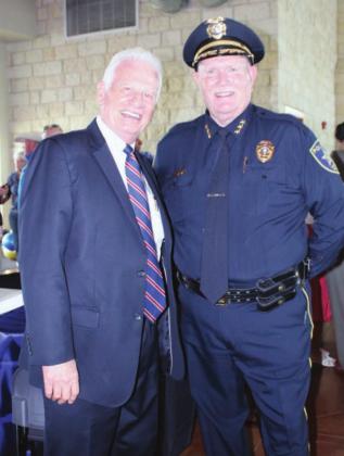 Left: Burnet County District Attorney Wiley “Sonny” McAfee, left, congratulates Marble Falls Police Chef Mark Whitacre on his retirement at Friday’s reception.