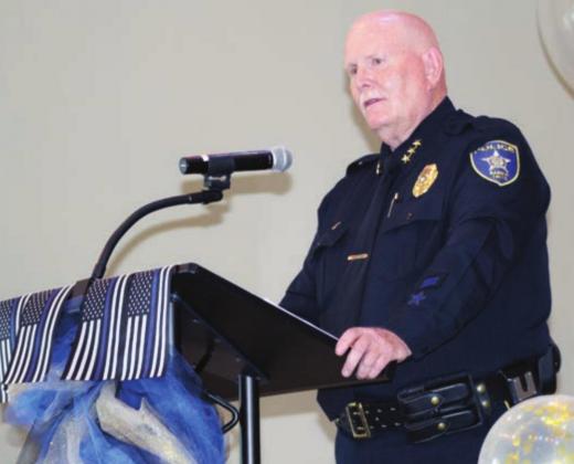 Left: Marble Falls Police Chief Mark Whitacre thanks those who attended his retirement ceremony at Lakeside Pavilion on Friday, June 25. Whitacre retired from the department after 30 years as chief of police.