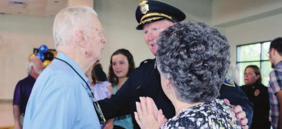 Below: Retired Burnet County Judge Martin McLean expressed his thanks to Marble Falls Police Chief Mark Whitacre during his retirement event June 25 at Lakeside Pavilion.