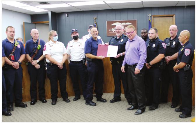 Marble Falls Mayor Richard Westerman proclaimed October as first responders month in the city at the regular council meeting on Oct. 5. He presented the proclamation to Marble Falls Police Chief Glenn Hanson (right) and Marble Falls Fire Rescue Chief Russell Sander (left). Connie Swinney/The Highlander