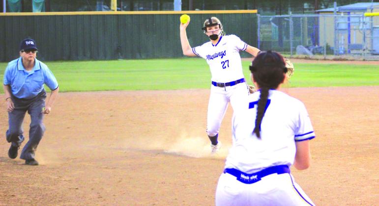 Junior second baseman Kylie Roberts throws to sophomore third baseman Cheyenne Thompson to ensure the Lady Badger stays on third.